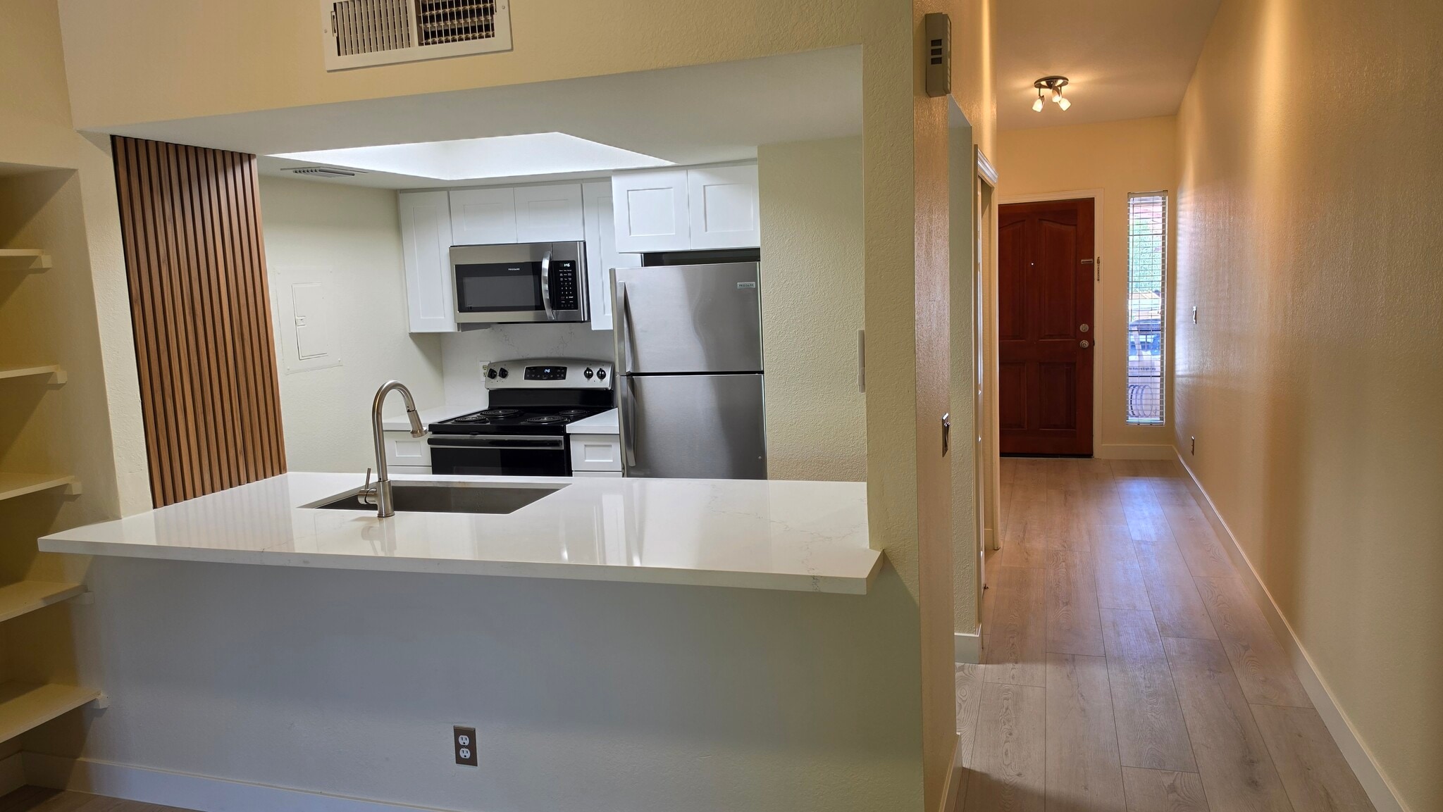 Kitchen with new cabinets and microwave - 1351 N Pleasant Dr