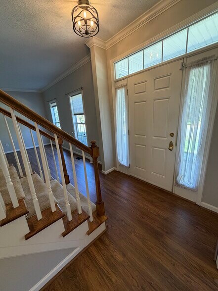 Entry area to the home with the Living Room and Dining Room flanking the entry - 6419 Woodmont Rd