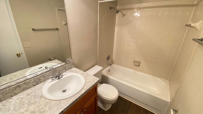 Building Photo - 2br/2ba Tradewinds Condo with Wood Floors ...