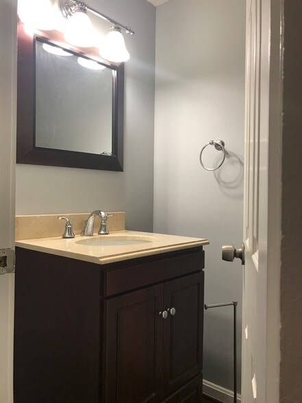 Half bath conveniently located off entry hallway for guests - 1200 23rd Street Northwest