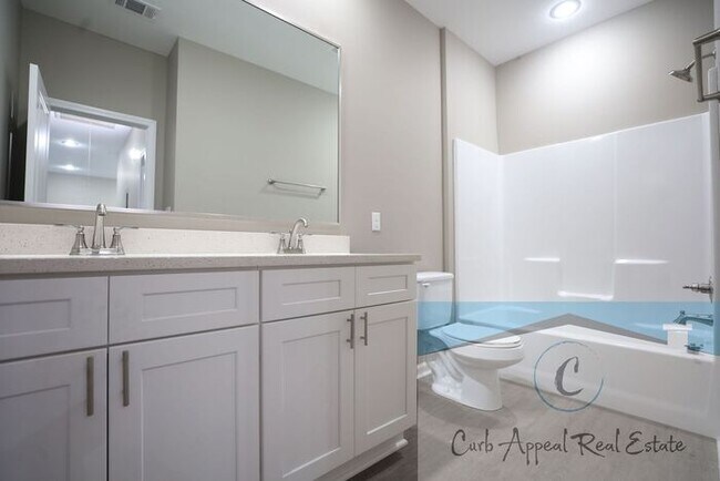 Building Photo - Luxury 2 bed 1 bath apartment - brand new construction!! Washer, dryer and utilities included!!