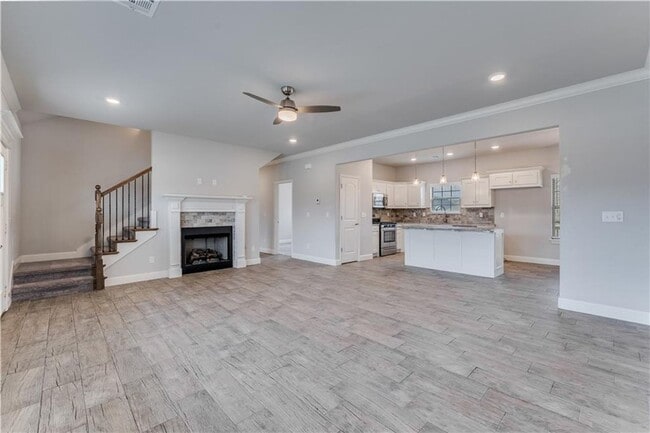 Building Photo - Minutes from I-49! 4BR/2.5BA Home