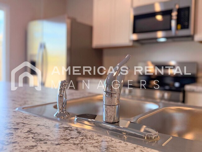 Building Photo - Spacious Two-Story Townhome with Open Layout!