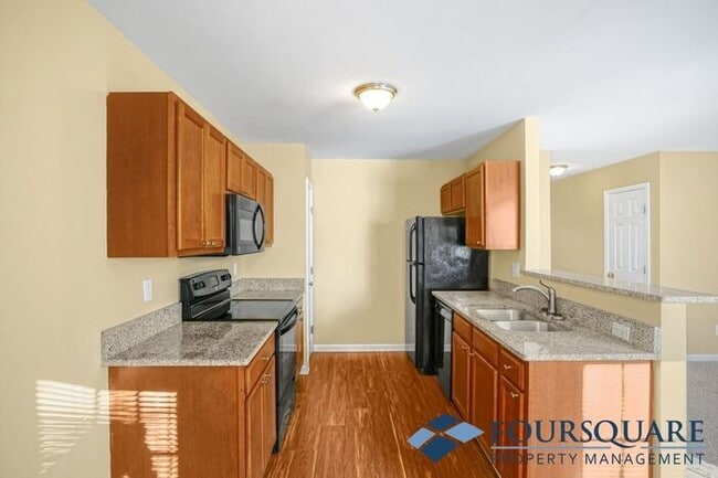 Building Photo - Charming 3-Bedroom Townhome with First-Floor Suite & Off-Street Parking – Near Capital Blvd & I-440