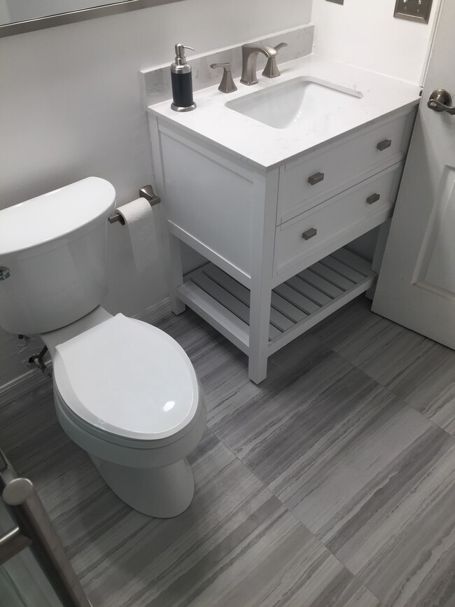 bathroom toilet and vanity - 808 Normandy Trace Rd