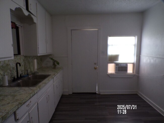 Building Photo - NEW listing-refinished hardwood floors, new laminate and paint throughout