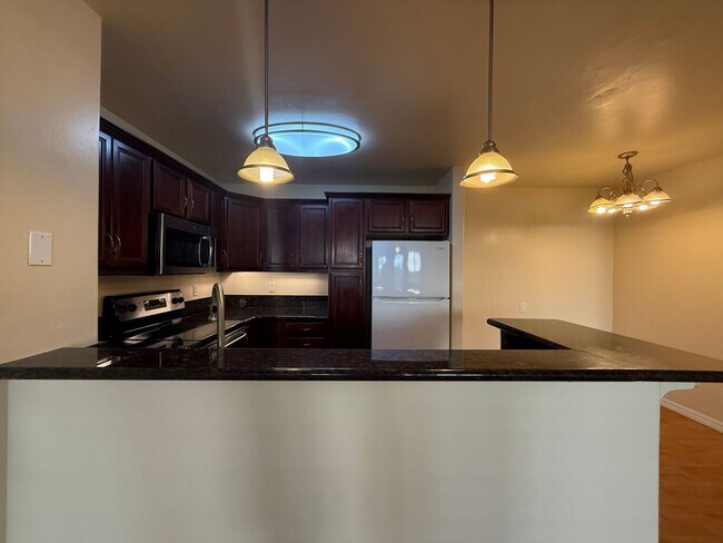 Building Photo - Upgraded Condo with Private Patio, AC, Pool, Gym, and Covered Parking in Gated Community