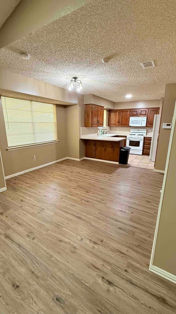 Building Photo - 3 bedroom / 2 bath / 2 car garage - Covered porch with shaded back yard