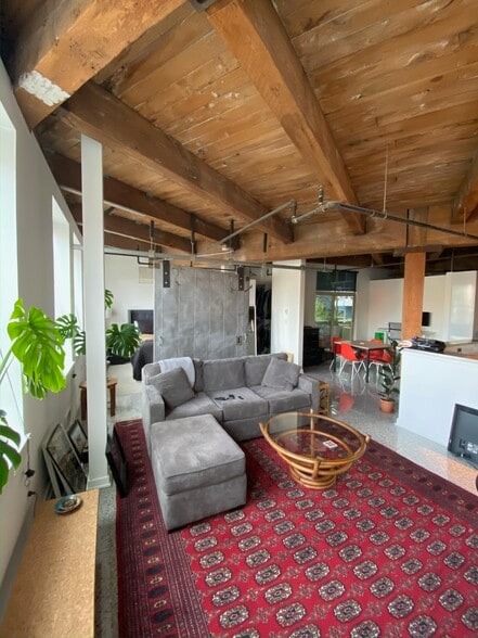 Living area separated by metal partition - 1408 12th Ave