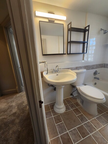 Bath with new mirror, shelves, lighting - 250 5th St NE