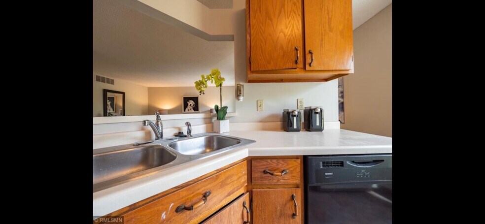 Kitchen, cabinets have been refinished, microwave replaced - 10918 Quebec Ave S