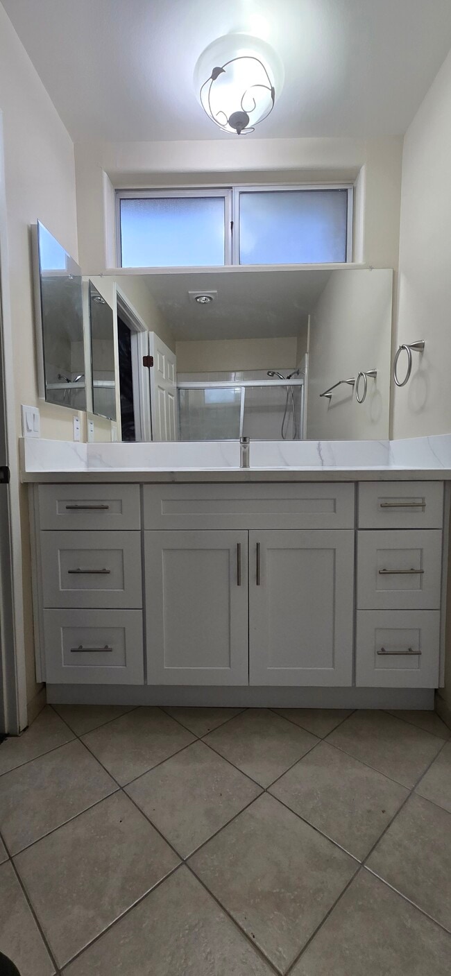 Wall-to-wall mirror over sink - 14365 Foothill Blvd