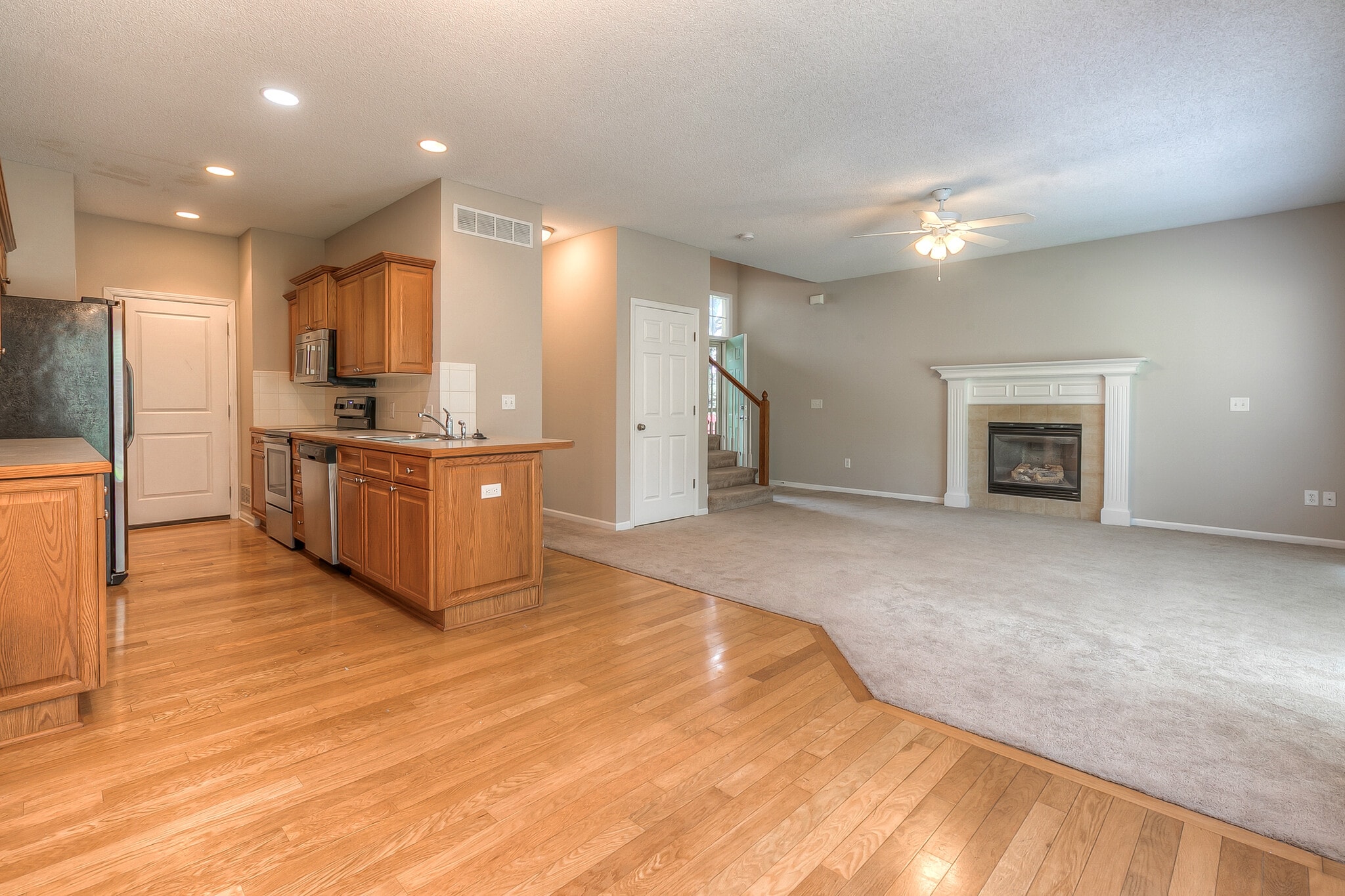open dining, living room and kitchen layout - 22810 West 71st Terrace