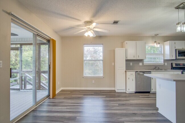 Building Photo - Live the Gulf Breeze Waterfront Life – Dock, Canal Access & Boat Lift!