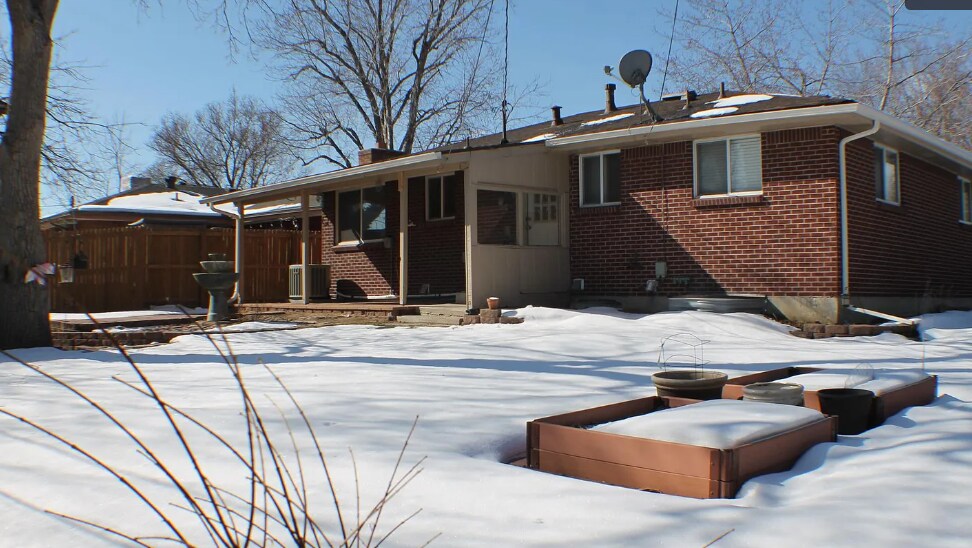 Large fenced in yard with covered porch - 6482 Zephyr St