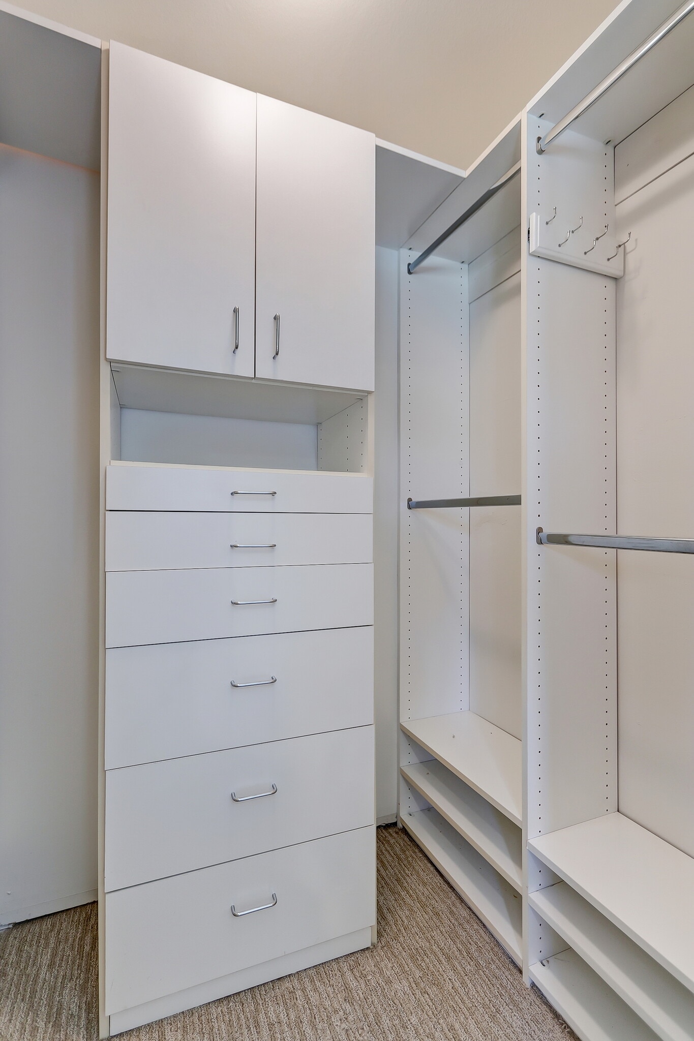 Primary bedroom features this walkin closet in addition to another cabinet. - 744 12th St