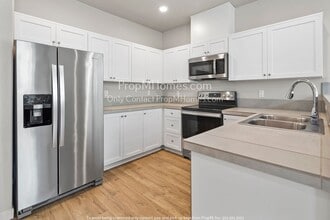 Building Photo - Charming One-Bedroom Condo in the Heart of Bull Mountain - Pool & Gym Access Included!