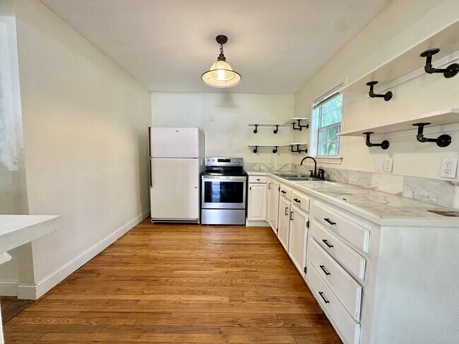 Building Photo - COMING APRIL 2026 - Charming Santa Rite Duplex! Yard Maintenance + Water/Sewer/Trash Included!