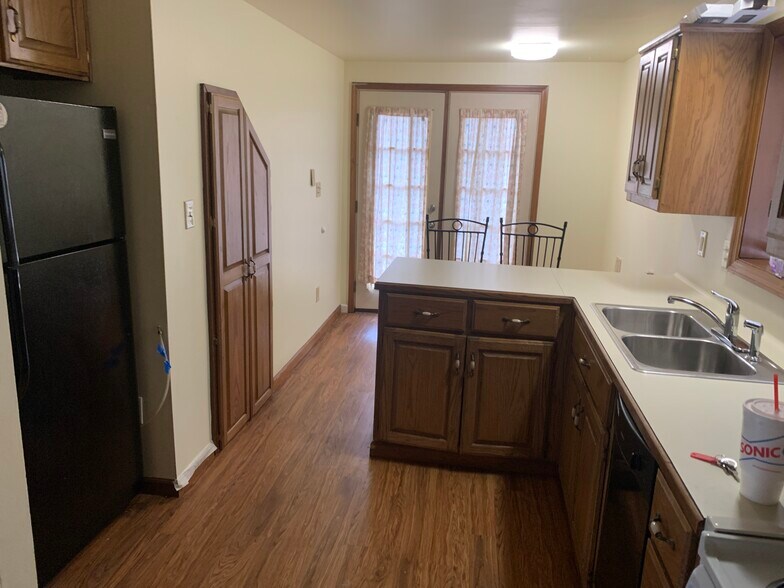 Kitchen from laundry room/half bath - 820 N Jackson St