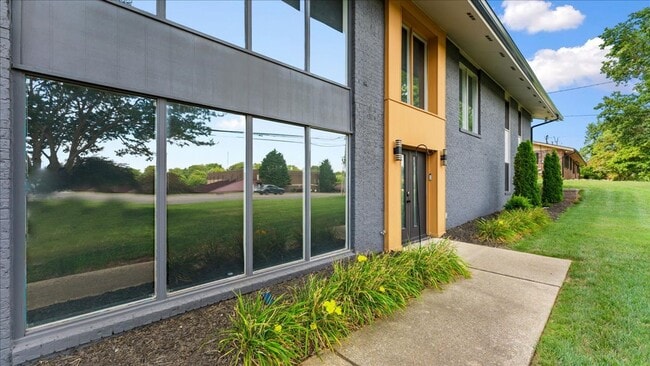 Building Photo - Renovated Mid-Century Modern Home in Belmont West with Finished Basement & Fenced Yard