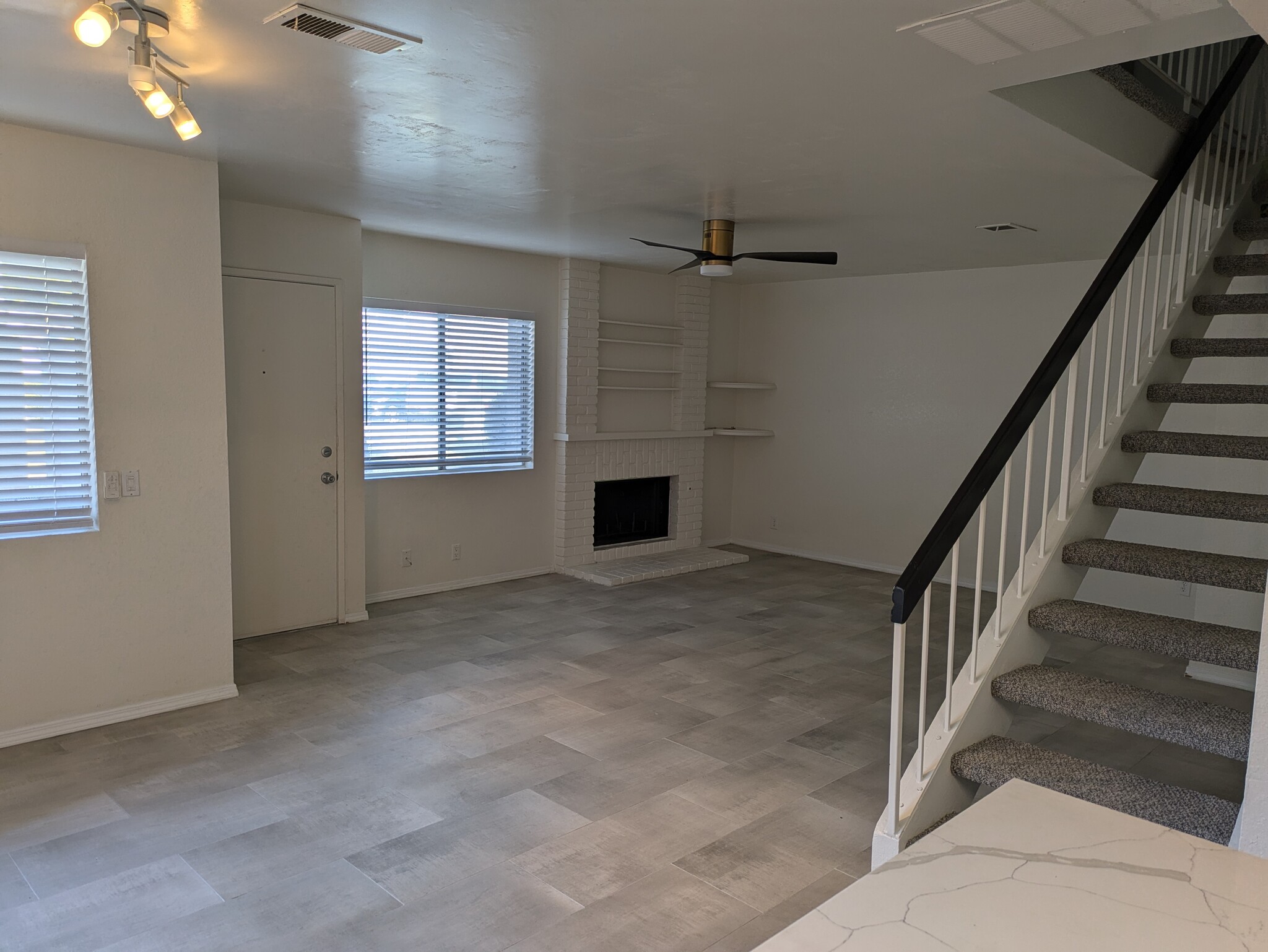 Spacious living room with cozy fireplace. - 13354 Birch Tree Ln