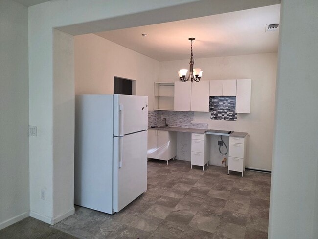 Building Photo - Spacious 5BR + Loft in Hamptons Village – Studio Suite, New HVAC, EV Charging