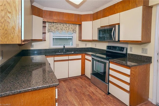 Building Photo - Earn Wealth While Leasing - Like a Homeown...