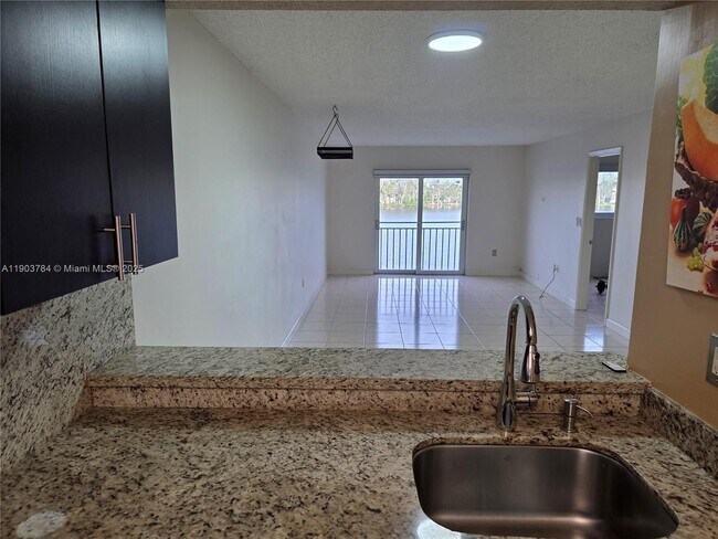 Building Photo - 9917 W Okeechobee Rd