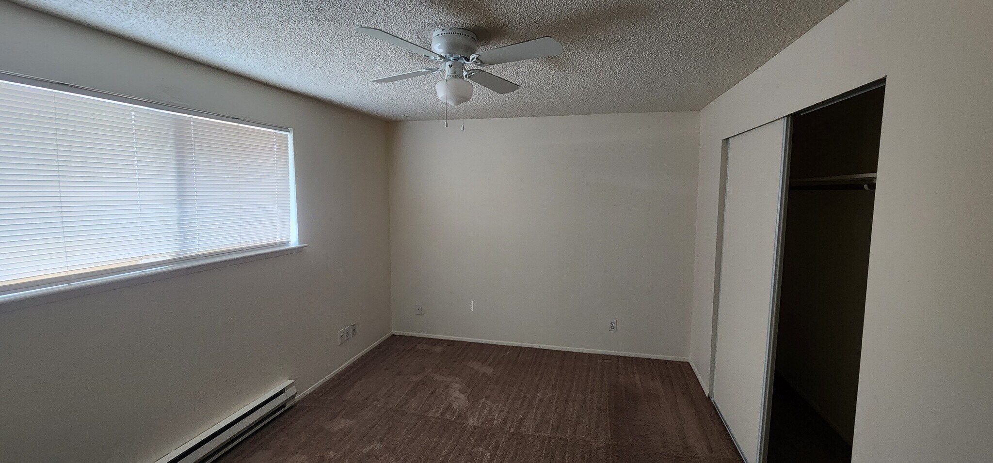 Bedroom with heater and ceiling fan - 521 159th St E