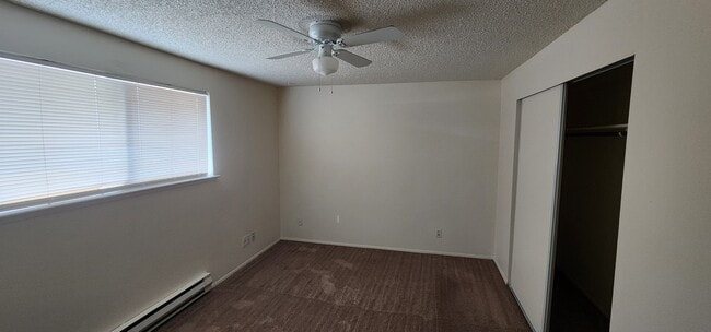 Bedroom with heater and ceiling fan - 521 159th St E