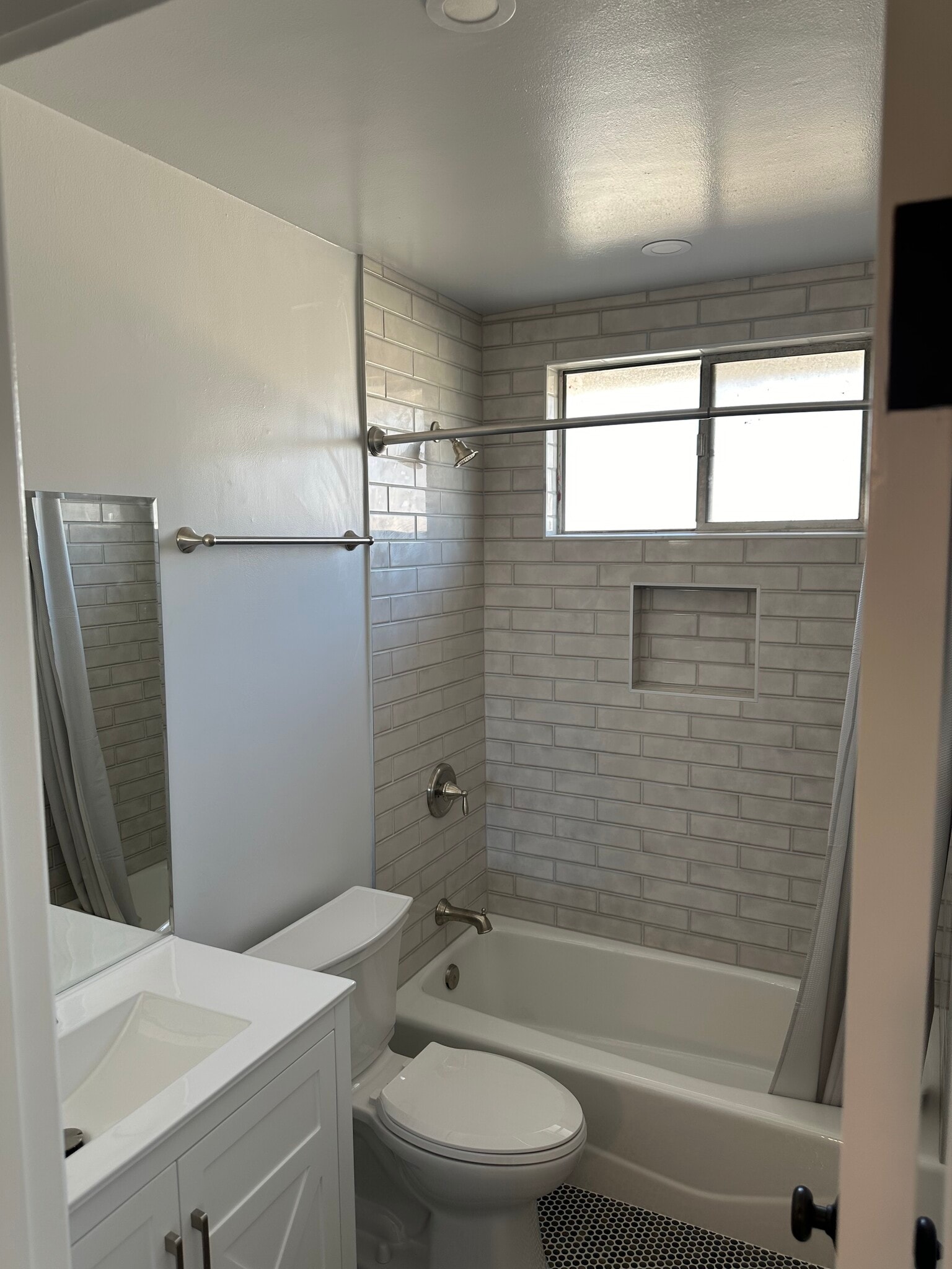 Newly renovated bathroom with custom tile - 1016 Western Ave