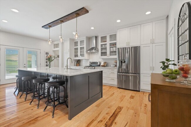 Building Photo - unning custom-built home on a full acre in...