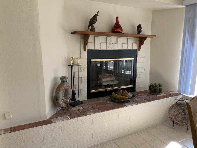 A cozy fireplace for those cool winter evenings. - 10113 W Pebble Beach Dr