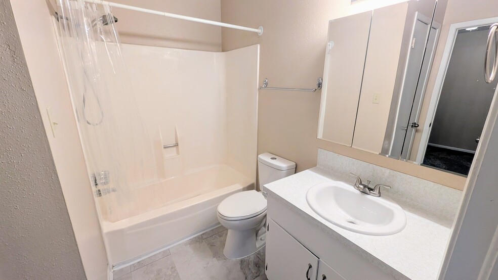 Full bath has medicine cabinet storage as well has below sink storage. - 813 Clubside Dr