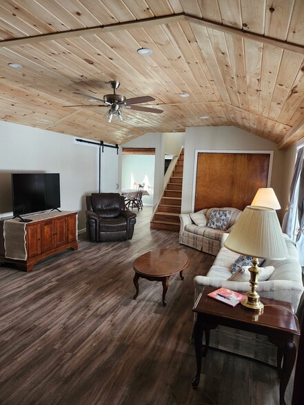 View from Entry into Living Room with Dining Room to left of Stairway - 8152 Wilson Karr Rd