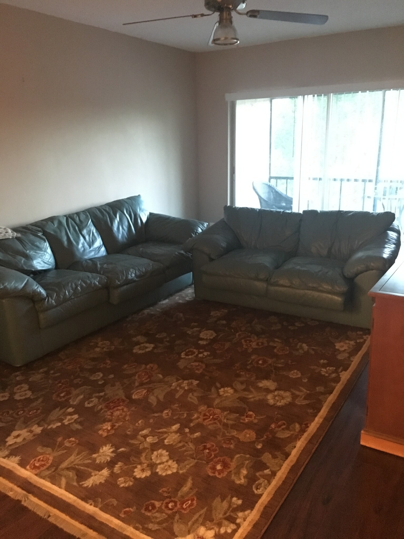 furnished living room with matching leather sofa & loveseat - 450 NW 20th St