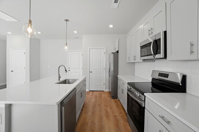 Building Photo - 4BR Home in The Pines at Paw Creek – New Construction + Private Deck