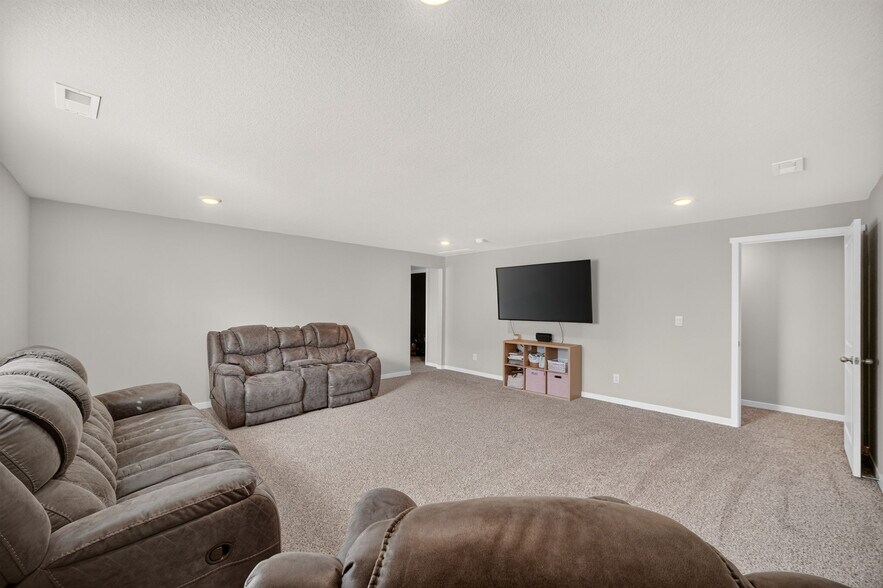 large family room in the lower level - 1080 Bel Aire Ct