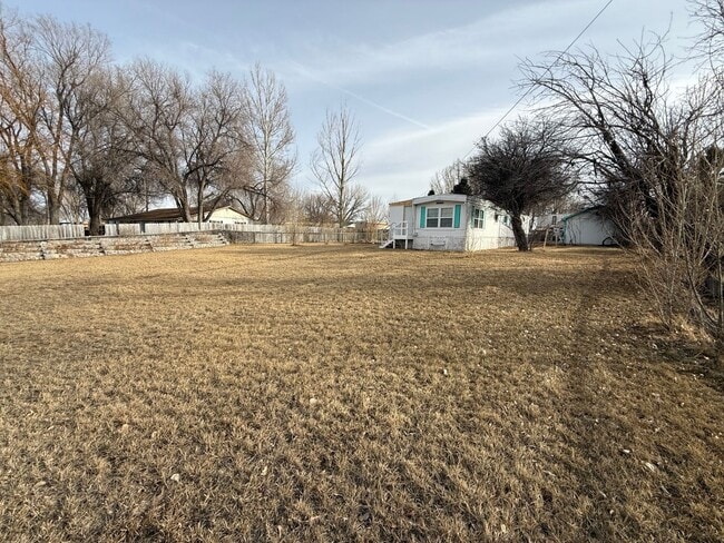 Building Photo - 2 Bedroom 1.5 Semi-Rural Mobile Home with Workshop on Large Lot