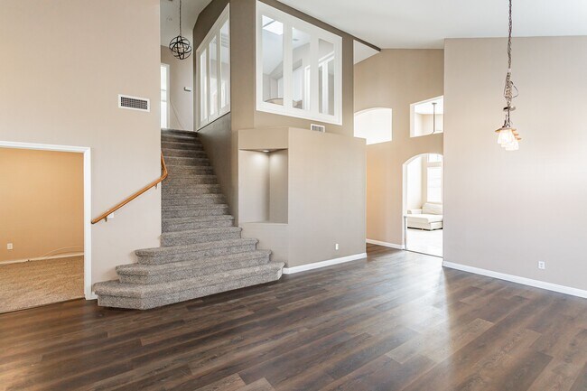 You can see the hallway to the left before the kitchen. That takes you to a bathroom then Master bed - 8600 Mirada del Sol Dr