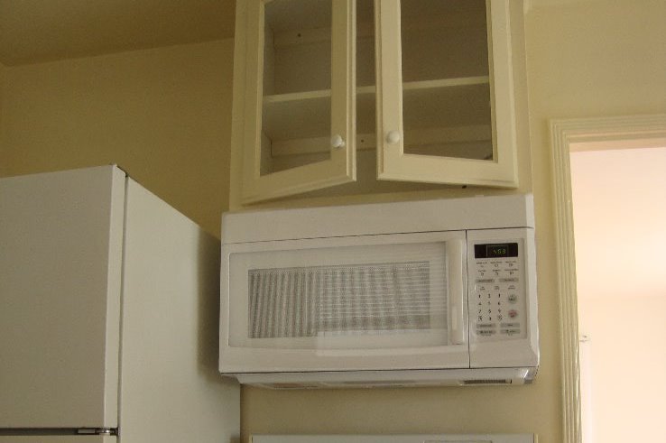 Microwave and cabinet - 812 Bard St