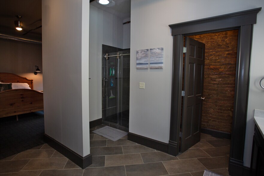 Master bath, shower on L; toilet and bidet behind R door - 225 E Blaine Ln