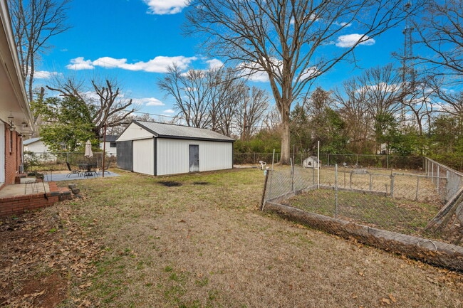 Building Photo - Classic Brick Ranch with 24x24 Workshop, Fenced Yard & Garden Beds