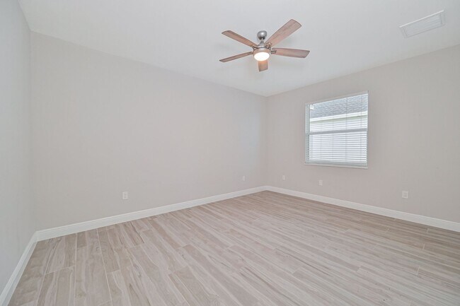 Building Photo - NOW AVAILABLE - Gorgeous Pool Home ~ NW Cape ~ 3 Car Garage ~ On Canal!