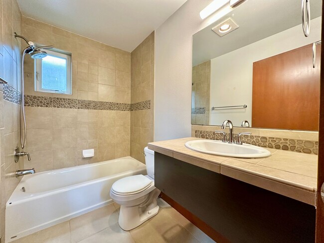 Building Photo - Modern 3-Bedroom Townhome with Stunning Ro...