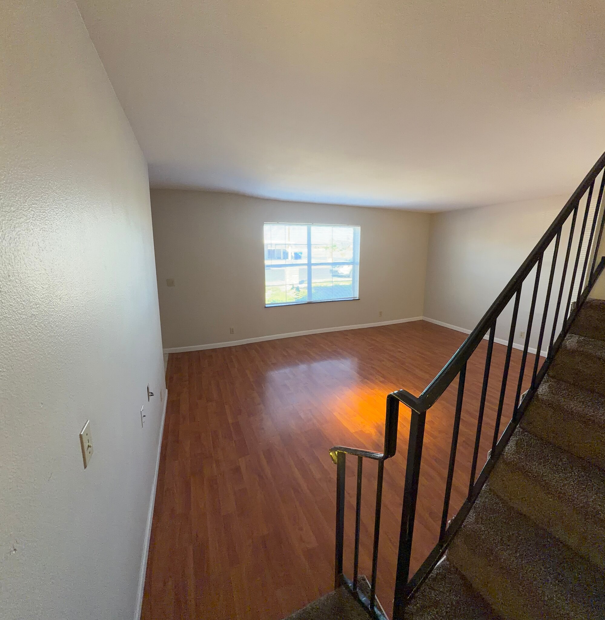 View of Family Room From Staircase - 121 E 14th Pl