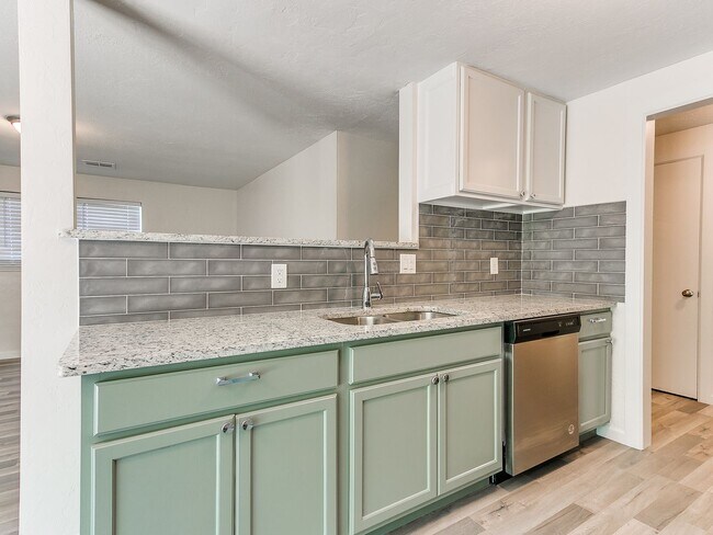Building Photo - 4 Bedroom/2 Bath home with fenced yard.