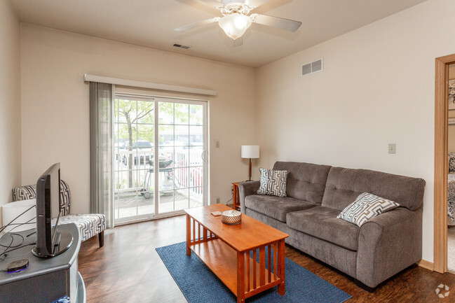 2BR, 2BA - 900 SF - Living Room - 210 Gray - Sunset View