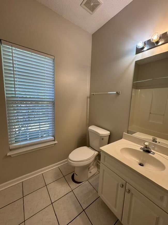 Building Photo - This 1.5  story, all brick, 3 bedroom, 2 bath, Bonus room upstairs & a 2 car garage with great st...