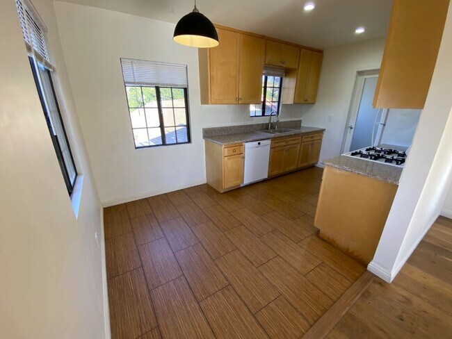 Separate dining space adjacent to the front door/living room area/kitchen. - 1733 Phillips Way